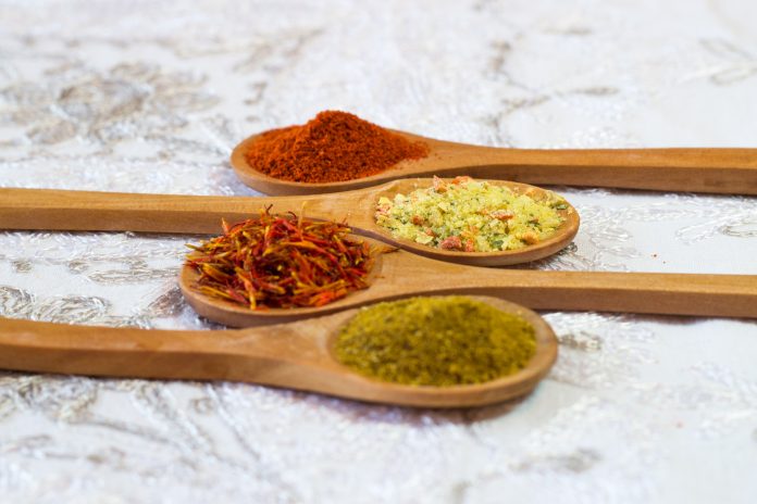 Spices. Spice in Wooden spoon. Herbs. Curry, Saffron, turmeric, cinnamon and other